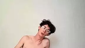 Horny young girl masturbating with big cock on bed.