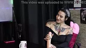 The clients praised her blowjob, so she demonstrated and stripped naked, showing her tits and pussy.