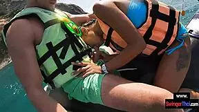 Asian girlfriend sucks cock hard on public jetski
