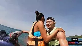 Asian girlfriend sucks cock hard on public jetski