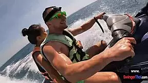 Asian girlfriend sucks cock hard on public jetski