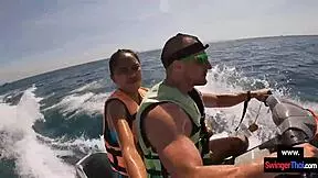 Asian girlfriend sucks cock hard on public jetski