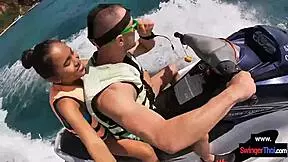 Asian girlfriend sucks cock hard on public jetski
