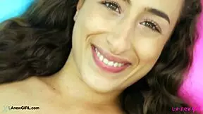 this radiant brunette casually shows off her sexy body on the sofa