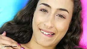 this radiant brunette casually shows off her sexy body on the sofa