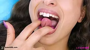 this radiant brunette casually shows off her sexy body on the sofa