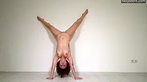 hot curly haired gymnast stretches flexible legs naked on sofa doing acrobatic pussy play