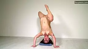 hot curly haired gymnast stretches flexible legs naked on sofa doing acrobatic pussy play