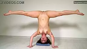 hot curly haired gymnast stretches flexible legs naked on sofa doing acrobatic pussy play