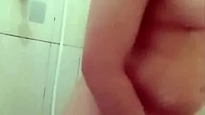 young woman showers while getting smooth waxed body