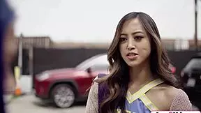 One asian cheerleader licks shaved classmate cunt on classroom desk casually