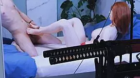 She strokes her girlfriend's feet, building up to a wild foot fetish climax.