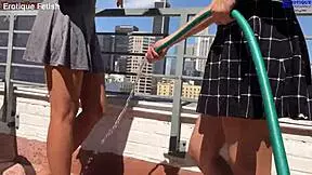 Erotique two amateur girls suck Eric John's monster cock for outdoor barefoot footjobs on balcony patio