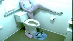 Hot blonde babe caught fingering herself hard in office toilet