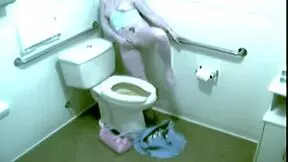 Hot blonde babe caught fingering herself hard in office toilet