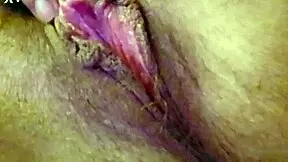 woman moans softly while rubbing clit with vibrator and fingers gently