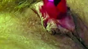 woman moans softly while rubbing clit with vibrator and fingers gently