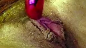 woman moans softly while rubbing clit with vibrator and fingers gently