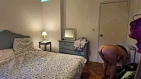 Stepmom leaves door open revealing her huge hairy pussy lips in the bedroom voyeur style.