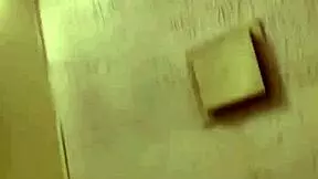 a cute girl sprinkles water playfully in her steamy shower scene