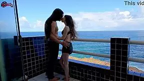 Having so much fun on the terrace balcony rooftop in front of ocean kissing flashing big natural tits pretty brunette babe