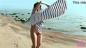 Skinny Tanned Blonde Arya Undresses Wet Pussy on Beach