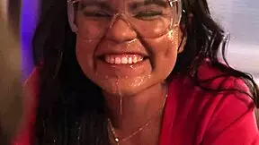 Two college students prepare for bedtime in shared dorm room