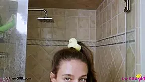 Sweet brunette beauty steps into steamy shower