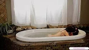 petite lesbian girlfriends lick shaved pussies in the pool tub