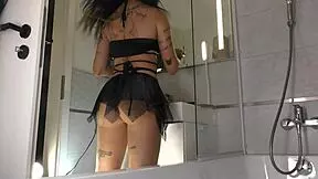 super sexy tattooed cheerleader teases her natural tits and skirt in bathroom.