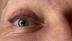 mature lady takes huge facial jizz load right on her eyes closeup