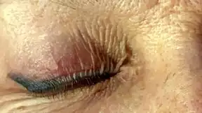 mature lady takes huge facial jizz load right on her eyes closeup