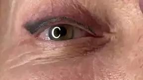 mature lady takes huge facial jizz load right on her eyes closeup