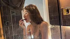 petite college cheerleader lifts miniskirt in bathroom shows thong pussy voyeur