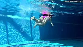 Jessica Lincoln glows in her pink bikini pool dip