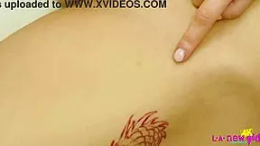 sexy asian teen strips naked for close-up tease on the sofa