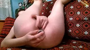 hot teen shoves bottle deep in ass while fingering wet pussy