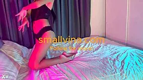 A cute young Asian babe shakes her big ass in panties