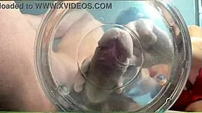 A gilf receives slow-motion cumshot in water from her muscular friend