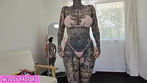MILF tries sheer micro bikini highlighting huge tits and curves