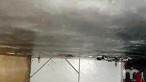 brunette teen sucks big black cock through gloryhole and swallows hot load