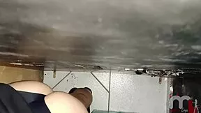 brunette teen sucks big black cock through gloryhole and swallows hot load