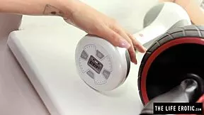 god, this sweaty brunette babe's perfect tanned body orgasms hard fucking a vibrating dumbbell in the gym