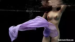 blackhaired aneta dives into the pool showing off her bikini body underwater