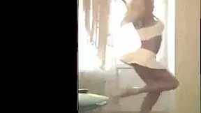 she sways her hips dancing in heels and short skirt just for you