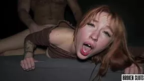 In a dimly lit room, the perfect redhead finds herself shared intimately by two guys during their heated group session.
