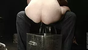 Bound babe takes massive enema loads in intense bondage session 😩