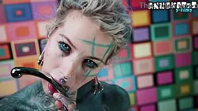 she teases her tight ass with fingers before taking a deep steel dildo plunge