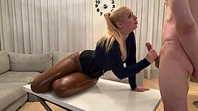 oily big-tittied blonde teen in latex pants slurps condom-covered cock deep