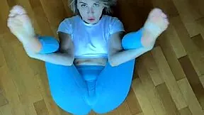 petite fitness babe stretches her body in tight leggings homemade workout